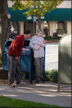 Breastfeeding against mailbox